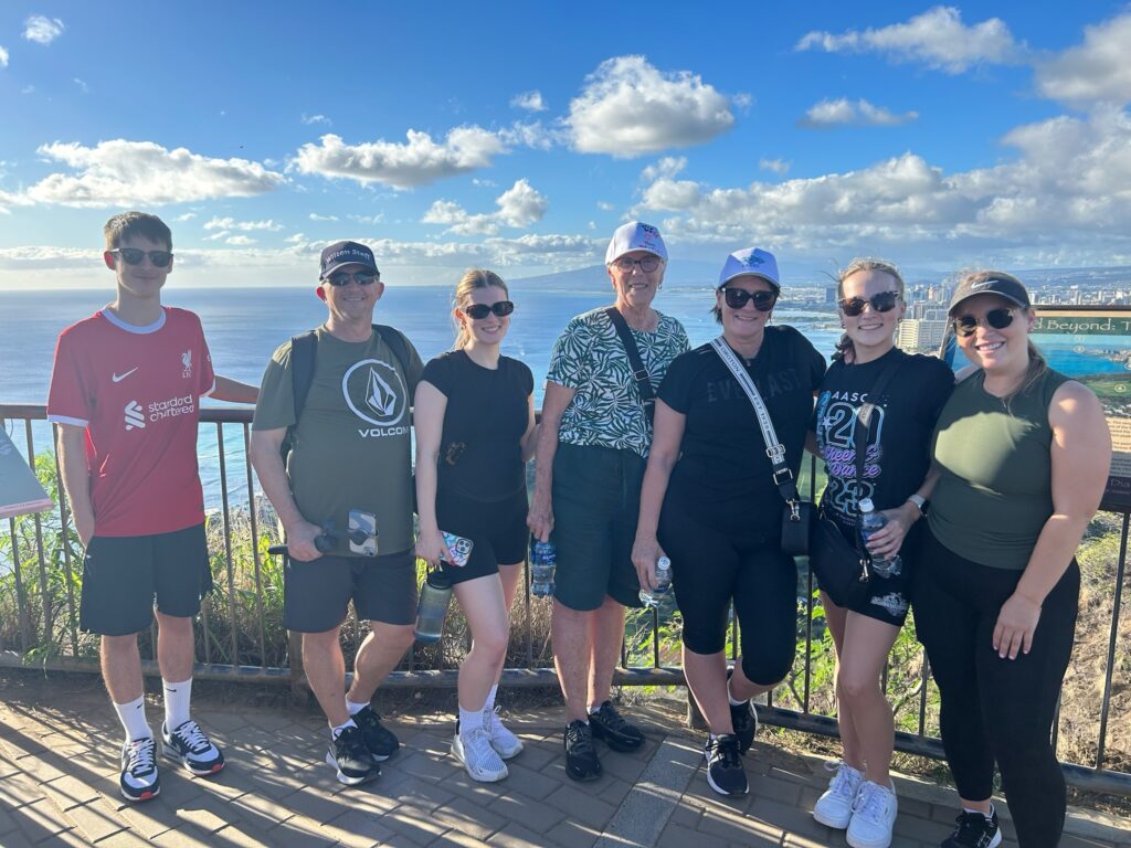 Family photo at the top of the Diamond Head Lookout - 48 Hour Itinerary in Hawaii