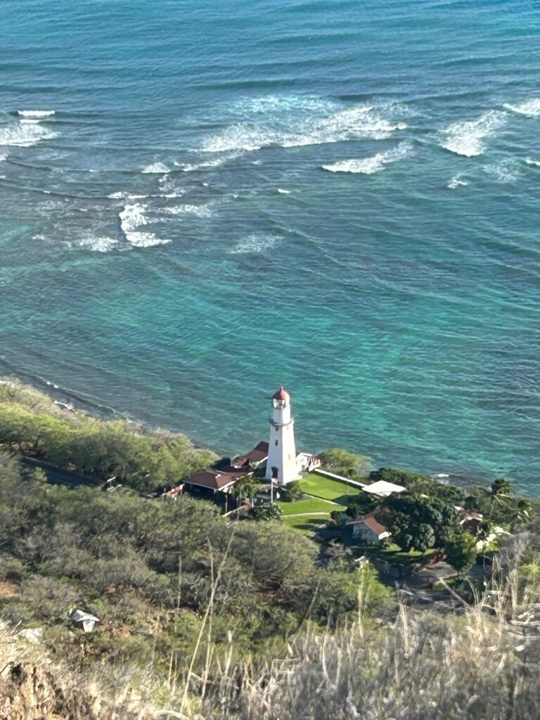 View from the top of Diamond Head Lookout, looking at the lighthouse and the ocean - 48 Hour Itinerary in Hawaii