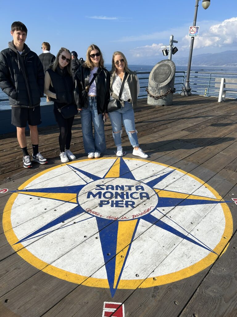 Photo of Santa Monica Pier sign at the end of the pier