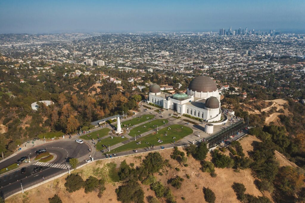 Ariel view of Griffith Observatory which is a great attraction to visit near Hollywood and Magic Castle Hotel.